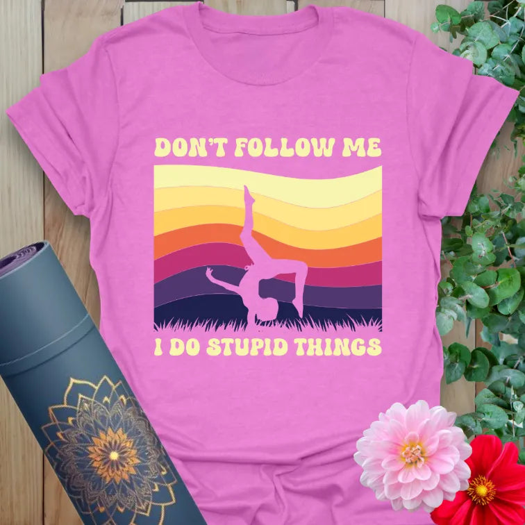 Purple Don't Follow T-Shirt with bold sunset colors and handstand silhouette