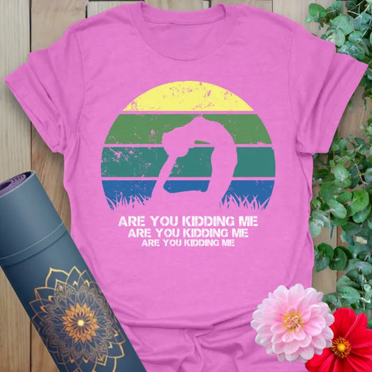 Radiant orchid-colored yoga tee featuring colorful sunset and fun yoga pose design perfect for soulful, conscious living.