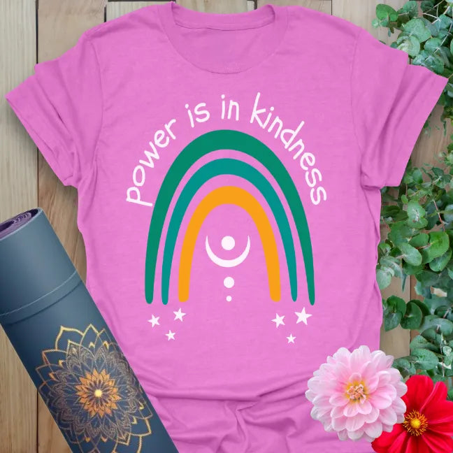 Radiant orchid-colored yoga tee featuring rainbow and celestial design with powerful kindness affirmation.