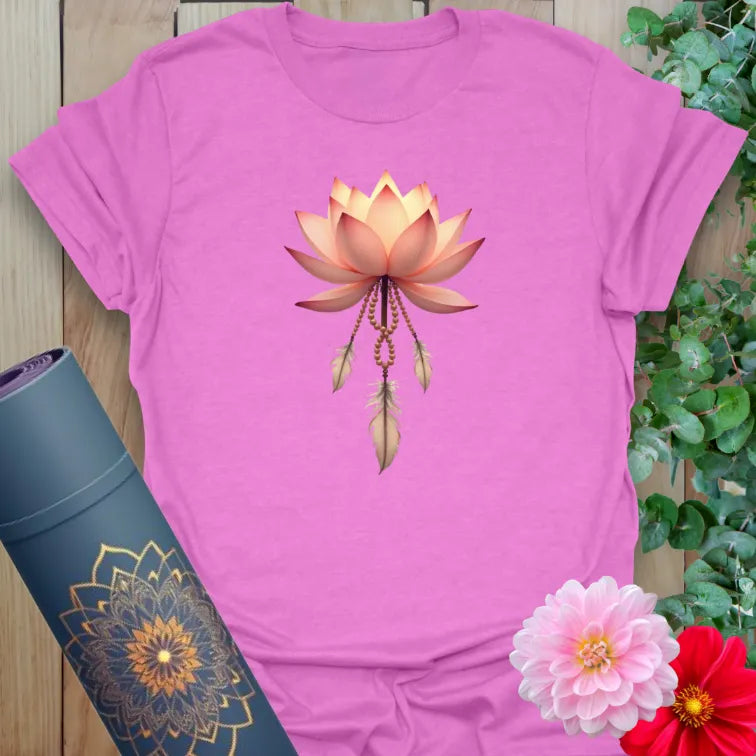 Radiant orchid-colored yoga tee with sacred lotus flower and feather charm design for conscious living.