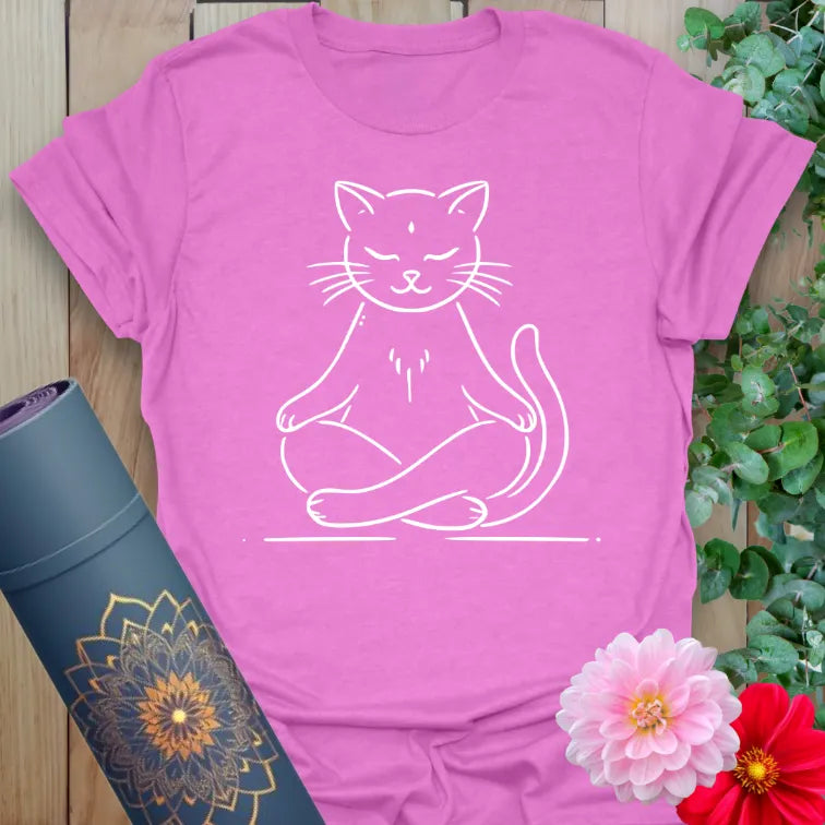 Radiant orchid-colored yoga tee with peaceful meditating cat illustration celebrating conscious, playful relaxation.