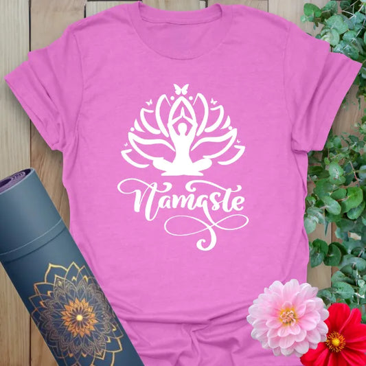 Radiant orchid-colored yoga tee with blooming lotus and Namaste affirmation celebrating heart-centered mindfulness and spiritual flow.