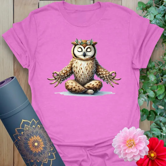 Radiant orchid-colored yoga tee with charming owl in meditative pose crowned by flowers, celebrating soulful living.