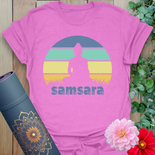 Radiant orchid-colored yoga tee with serene meditating figure and sunset design celebrating the cycle of life and mindful rebirth.