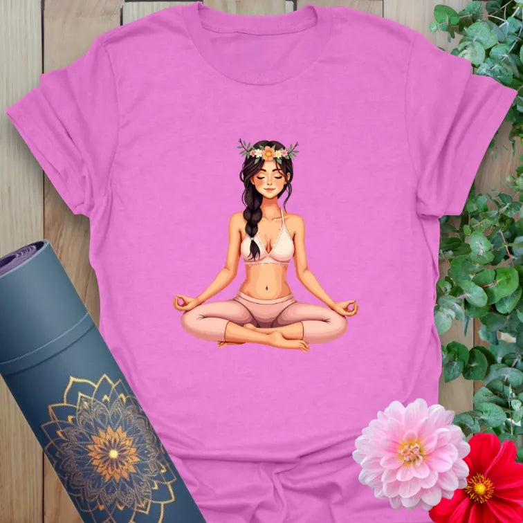 Radiant orchid-colored yoga tee with serene meditation figure and flower crown symbolizing conscious beauty and spiritual peace.