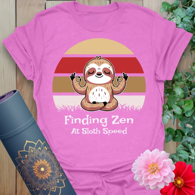 Radiant orchid-colored yoga tee with playful sloth zen design celebrating mindful relaxation and peaceful soul flow.