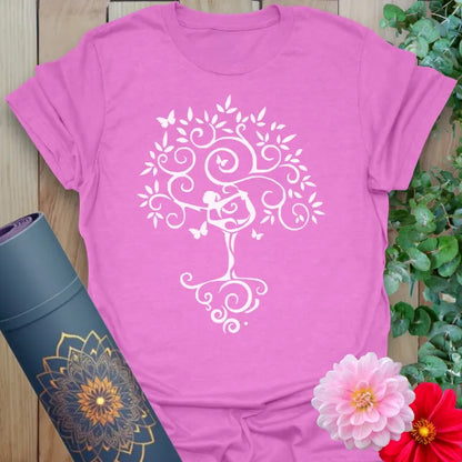 Radiant orchid-colored yoga t-shirt showcasing yogi in Tree Pose becoming a blooming tree, with butterflies.