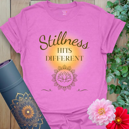 Stillness Hits T-Shirt in Heather Radiant Orchid with glowing yellow aura and delicate lotus detail. A soft yoga gift tee with style and spirit.