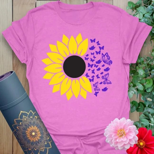 Radiant orchid-colored tee with golden sunflower bursting into purple butterflies for conscious, colorful expression.