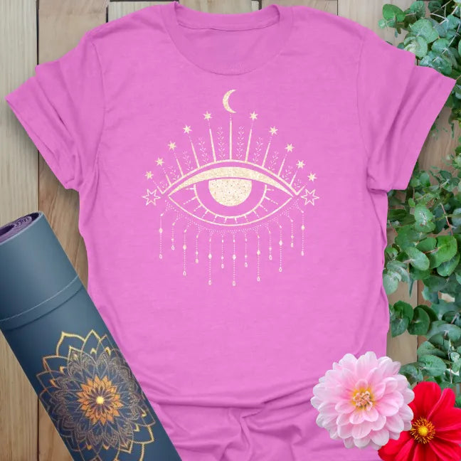 Radiant orchid-colored tee showcasing gold third eye symbol with moon and stars for conscious living.