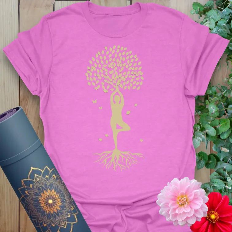 Radiant orchid-colored tee with golden yoga silhouette and blooming tree design for soulful, centered living.