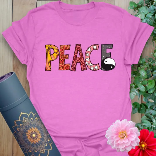 Radiant orchid-colored tee with illustrated peace typography and yin yang icon for harmony-driven wear.