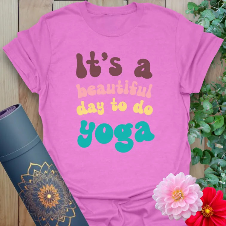 Radiant orchid-colored tee with bright yoga affirmation in retro style for bold, feel-good fashion.