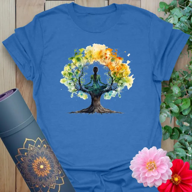 Blue yoga tee with multicolor tree of life and meditating figure artwork