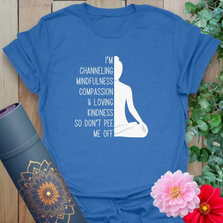 Blue yoga tee with mindful quote and meditative figure artwork

