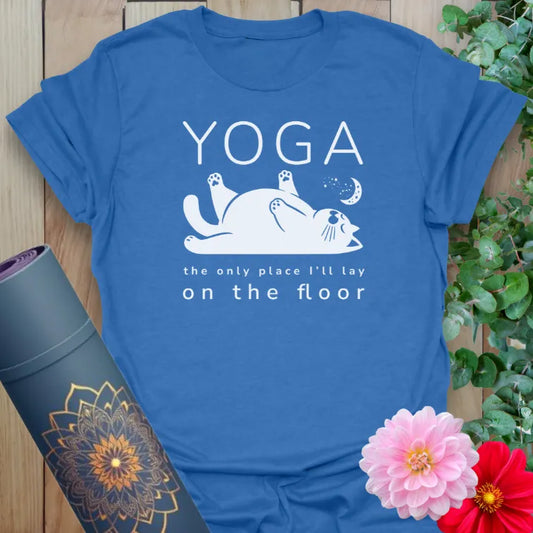 Soft cotton unisex yoga t-shirt featuring playful cat illustration and humorous "Yoga: the only place I'll lay on the floor" quote.