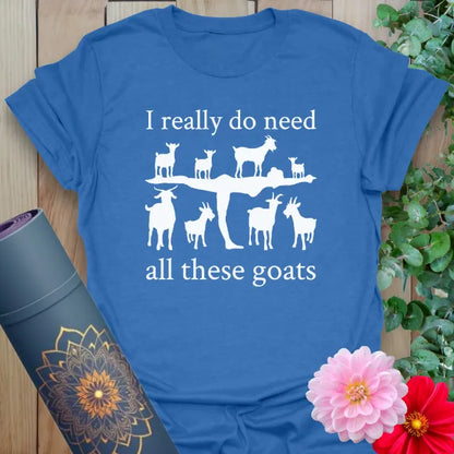Soft cotton unisex yoga t-shirt featuring playful goat silhouette and "I really do need all these goats" quote for joyful, mindful living.