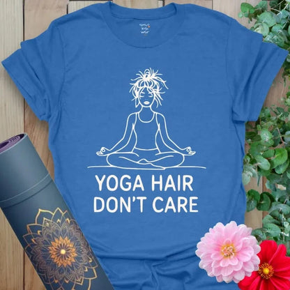 Heather Royal Hair T-Shirt with bold white print: seated yogi, messy hair, and “Yoga Hair Don’t Care” slogan. Unisex yoga and activewear tee.