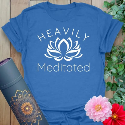 Soft cotton unisex yoga t-shirt featuring playful "Heavily Meditated" quote with lotus flower for mindful, soulful living.