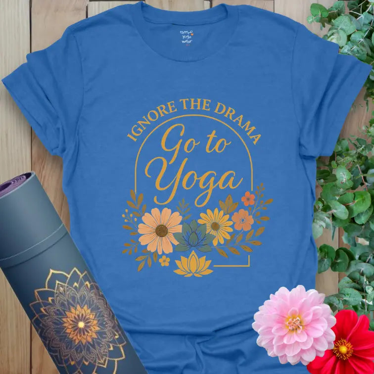 Vibrant floral arch and elegant yoga script on the heather royal tee, uplifting and eye-catching.