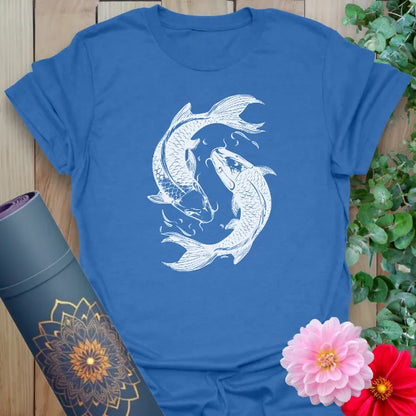 Soft cotton unisex yoga t-shirt featuring graceful koi fish yin-yang design symbolizing balance, resilience, and mindful flow.