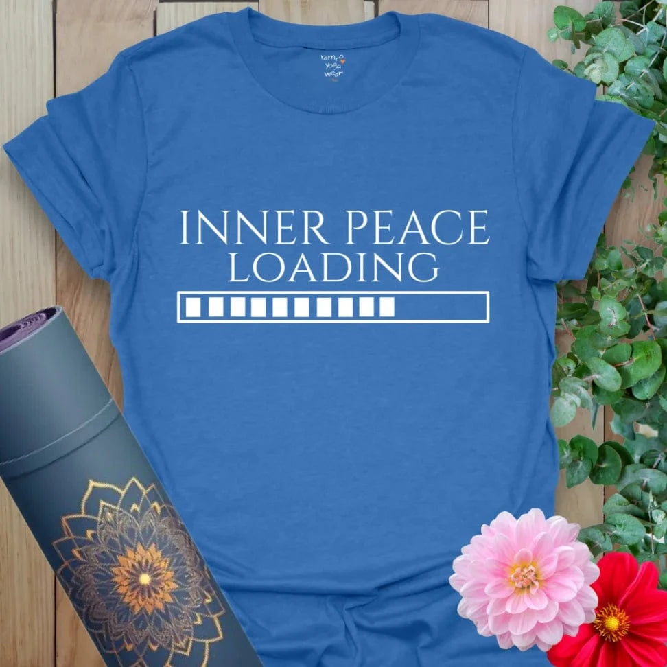 Soft heather royal yoga tee featuring “INNER PEACE LOADING” with progress bar design for lighthearted spiritual style.