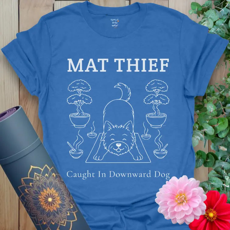 Heather Royal Mat Thief T-Shirt showing a cheeky dog “caught” on the yoga mat; perfect for yogis with pups.