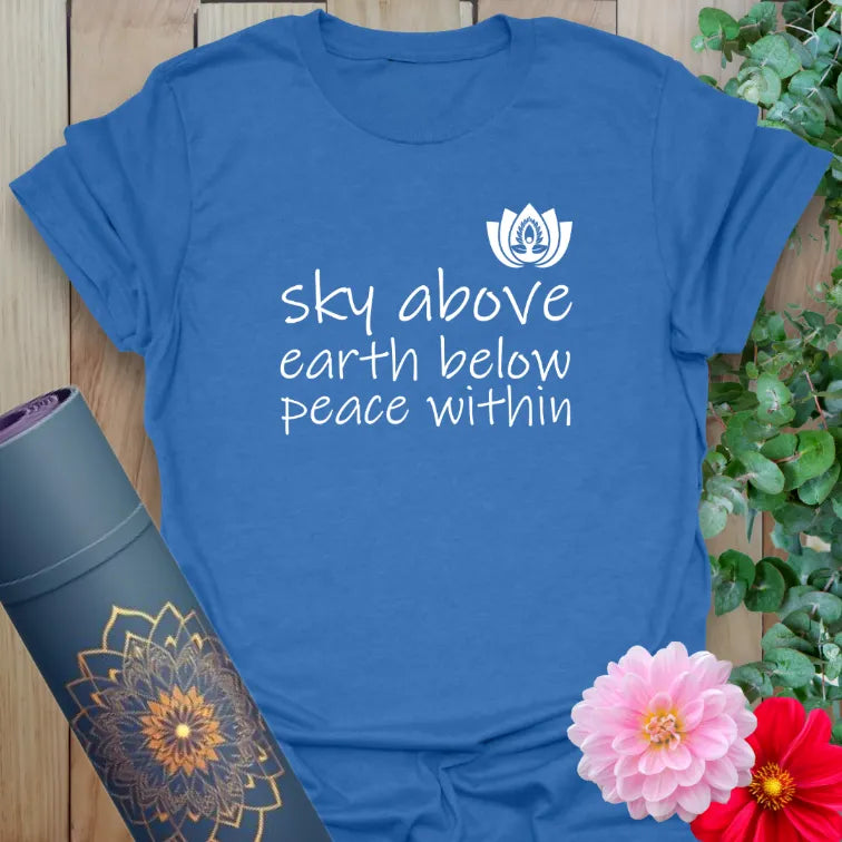 Soft cotton unisex yoga t-shirt featuring "Sky Above, Earth Below, Peace Within" mantra and lotus artwork for mindful living and soulful grounding.
