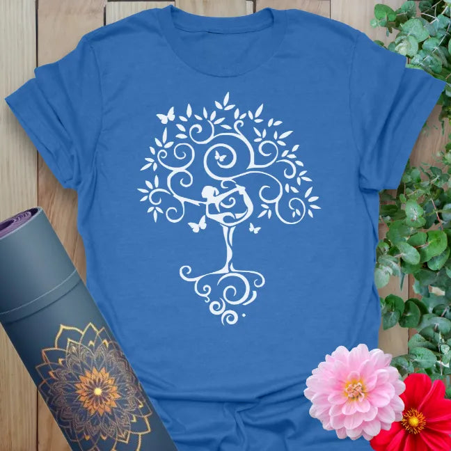 Soft cotton yoga tee featuring Tree Pose silhouette and flourishing tree design with swirling branches and butterflies.
