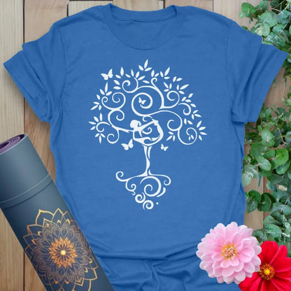 Soft cotton yoga tee featuring Tree Pose silhouette and flourishing tree design with swirling branches and butterflies.