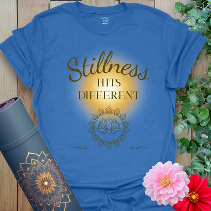 Heather Royal Stillness Hits T-Shirt with warm script and mindful messaging. A calming unisex tee for yogis who love quiet power.