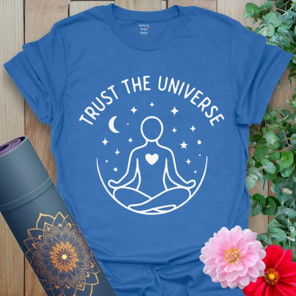 Soft cotton yoga tee featuring seated figure with open heart beneath celestial sky and “Trust the Universe” message.