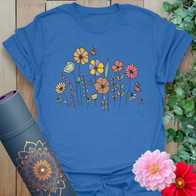 Soft cotton yoga tee featuring hand-drawn wildflowers and butterflies in vintage style for grounded, soulful living.