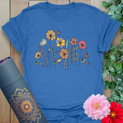 Soft cotton yoga tee featuring hand-drawn wildflowers and butterflies in vintage style for grounded, soulful living.