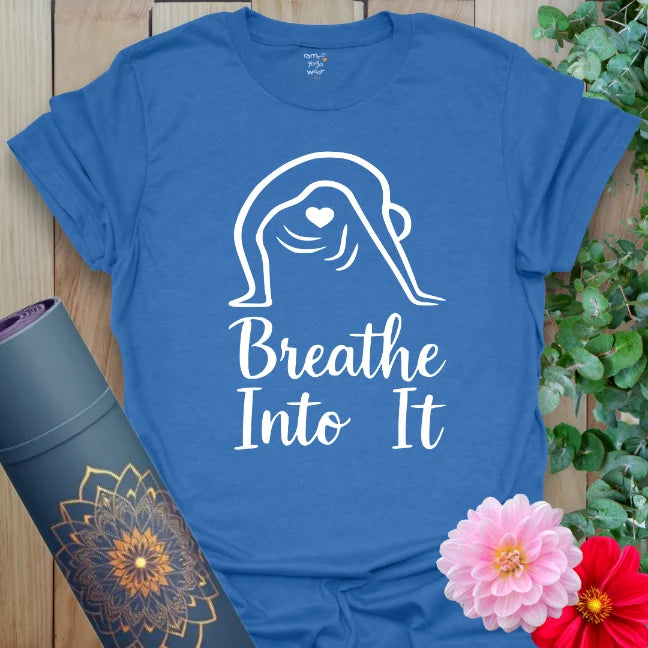 Soft cotton yoga tee featuring calm one-line yogi design and “Breathe Into It” affirmation for centered living.