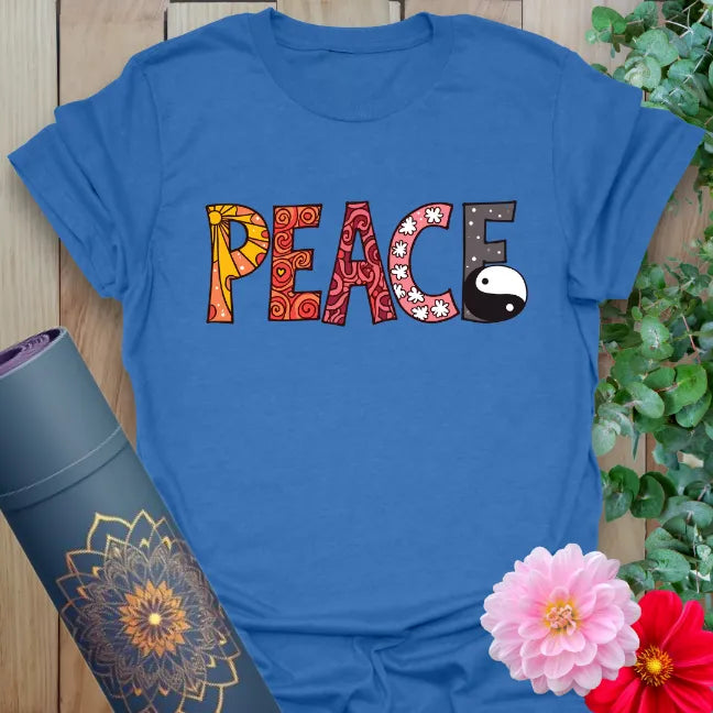 Soft cotton yoga tee featuring colorful “PEACE” lettering with yin yang symbol for bold, mindful expression.