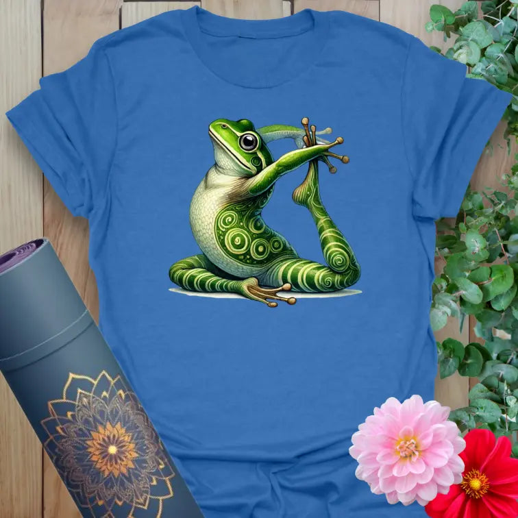 Soft cotton yoga tee featuring a detailed green frog in seated yoga pose with spiral markings for playful spiritual style.