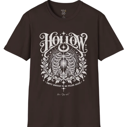 Symbolic ribcage engraving with a single glowing light at the center, crescent moon behind. Hollow T-Shirt flat lay is a Gildan 64000 and the color is Dark Chocolate.