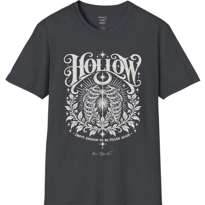 Symbolic ribcage engraving with a single glowing light at the center, crescent moon behind. Hollow T-Shirt flat lay is a Gildan 64000 and the color is Dark Heather Grey.