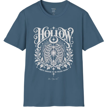 Symbolic ribcage engraving with a single glowing light at the center, crescent moon behind. Hollow T-Shirt flat lay is a Gildan 64000 and the color is Indigo Blue.