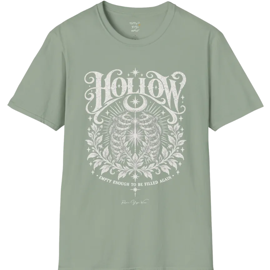 Symbolic ribcage engraving with a single glowing light at the center, crescent moon behind. Hollow T-Shirt flat lay is a Gildan 64000 and the color is Sage.