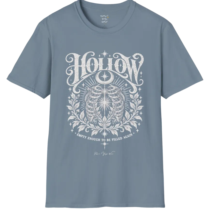 Symbolic ribcage engraving with a single glowing light at the center, crescent moon behind. Hollow T-Shirt flat lay is a Gildan 64000 and the color is Stone Blue.