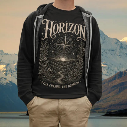 Person wearing Horizon tee in black, a sacred yoga shirt in the mountains with snow-capped peaks — Sacred Thread collection by Ramro Yoga Wear