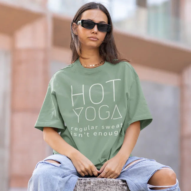 Woman wearing the Hot Yoga T-Shirt in Sage outdoors with sunglasses — The Vault collection by Ramro Yoga Wear