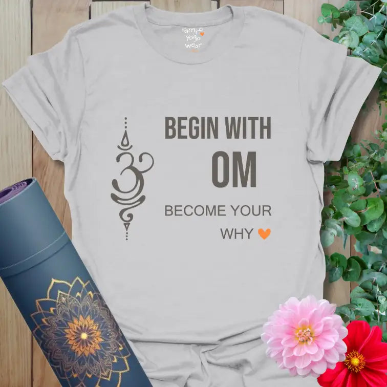 Minimalist yoga tee in soft ice gray with Om symbol and orange heart accent.