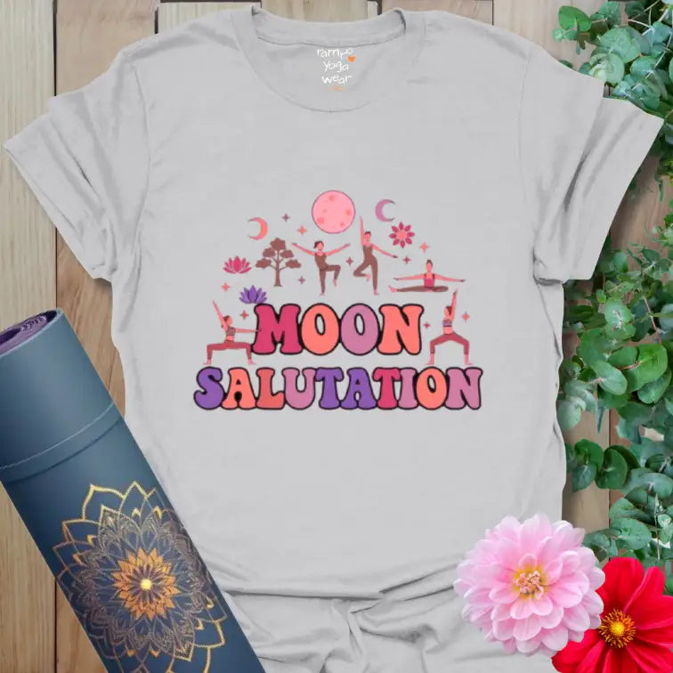 Ice Grey Moon Salutation T-Shirt with soft pastel moon and yoga silhouettes. A calm, neutral tee for quiet evening flows.