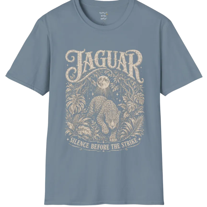 A grunge short sleeved tee with an illustrated jaguar resting in tropical foliage, crescent moon above, text reading "Jaguar" and "Silence Before The Strike" — Wild Animals collection by Ramro Yoga Wear in Stone Blue