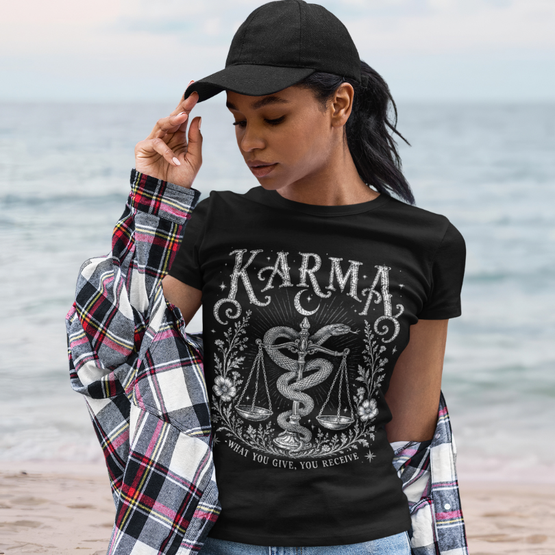 Woman wearing Karma black sacred yoga shirt at the beach — Sacred Thread collection by Ramro Yoga Wear