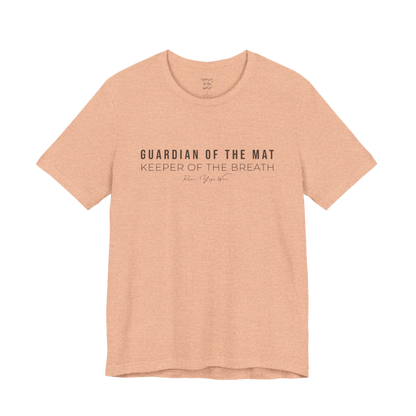 GUARDIAN OF THE MAT KEEPER OF THE BREATH yoga teacher gift tee flat lay in Heather Peach — Yoga Teacher Gifts collection by Ramro Yoga Wear