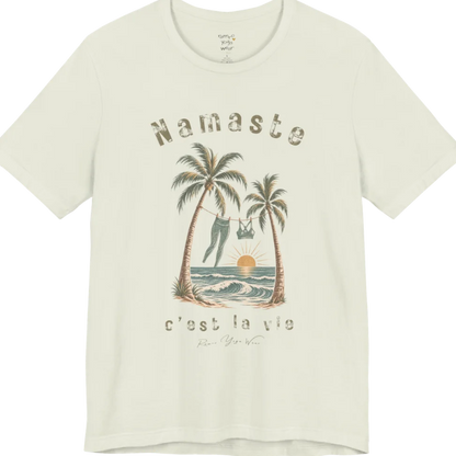A short sleeved grunge tee with an illustrated scene of two palm trees framing a clothesline with leggings and a sports bra hanging between them, sun setting over waves, text reading "Namaste" and "c'est la vie" — Funny Yoga Shirts collection by Ramro Yoga Wear in Citron.